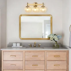3-Light Brass Ribbed Glass Globe Vanity Wall Sconce